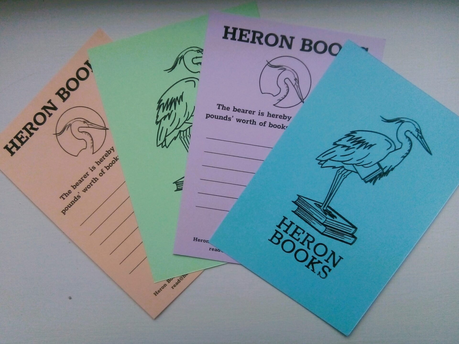 Heron Books Vouchers on coloured card